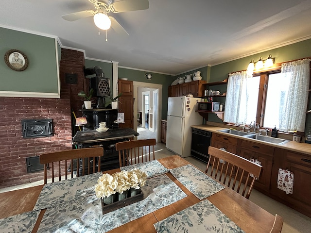 kitchen featuring light wood-type flooring, crown molding, sink, dishwasher, and white fridge