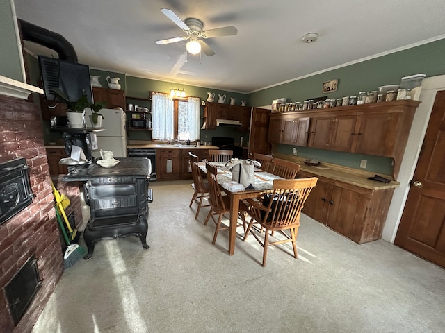 dining space featuring ceiling fan and ornamental molding