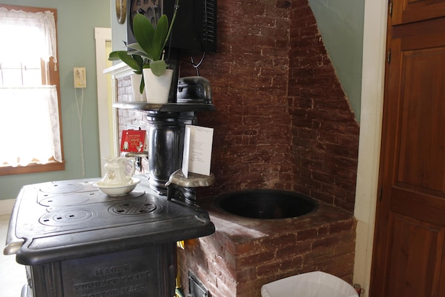 bathroom featuring brick wall