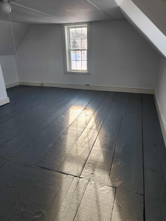 additional living space with vaulted ceiling