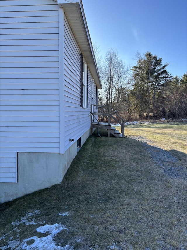 view of home's exterior featuring a yard