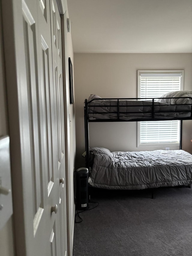 bedroom featuring carpet