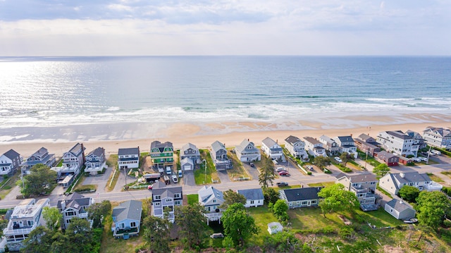 aerial view with a view of the beach and a water view