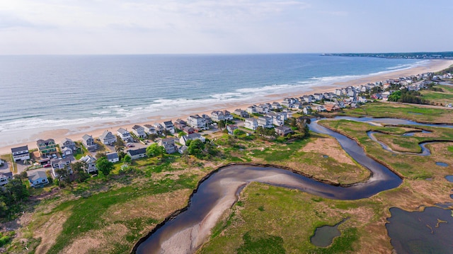 bird's eye view with a water view and a view of the beach