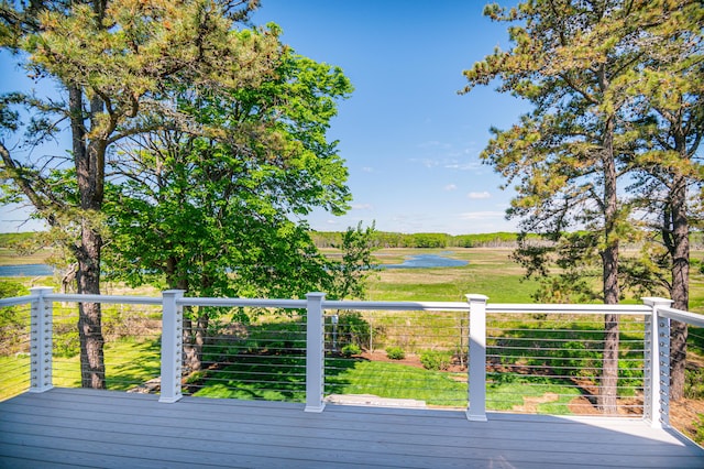 wooden deck featuring a water view