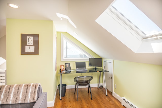 office space featuring wood-type flooring, lofted ceiling, and a baseboard radiator