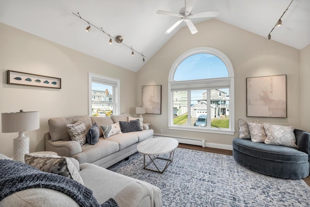 living room with ceiling fan, baseboard heating, track lighting, lofted ceiling, and hardwood / wood-style flooring