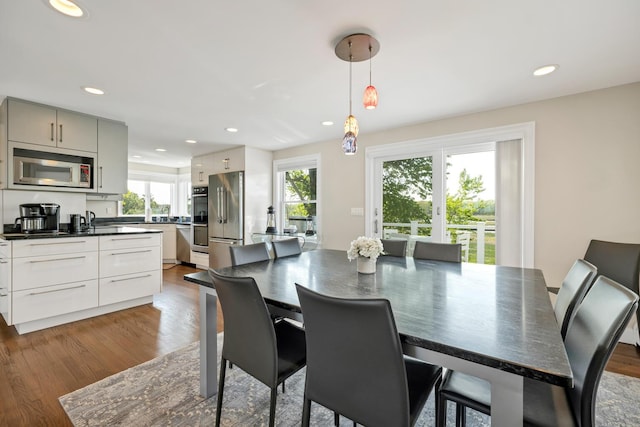 dining room with hardwood / wood-style floors and plenty of natural light