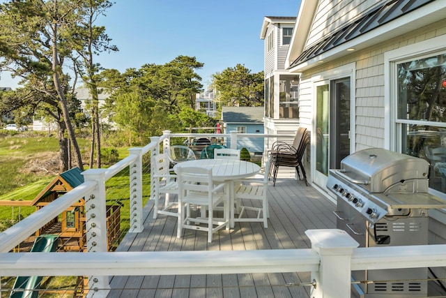 wooden deck featuring grilling area