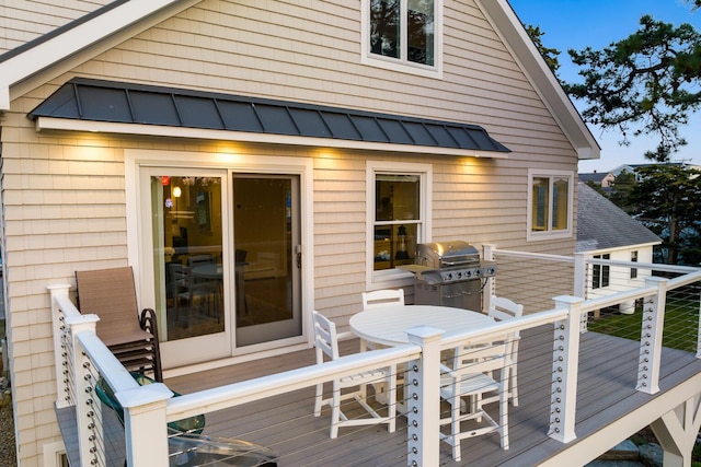 wooden terrace featuring area for grilling