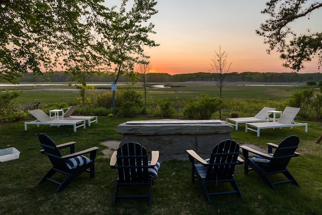 yard at dusk with a rural view