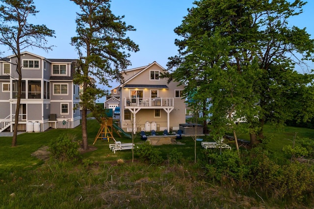 rear view of property featuring a balcony