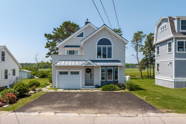 view of front facade featuring a garage and a front lawn