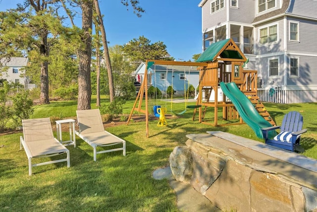 view of playground featuring a yard