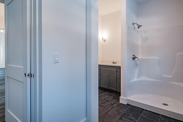 bathroom with vanity and walk in shower