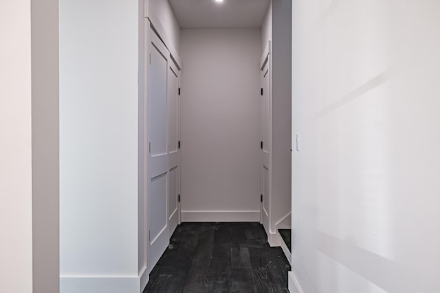 hallway featuring dark hardwood / wood-style floors