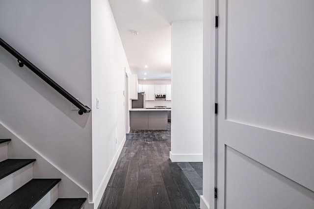 corridor featuring dark wood-type flooring