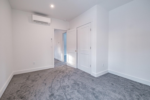 carpeted empty room featuring a wall mounted AC