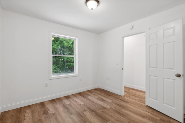 empty room with light wood-type flooring