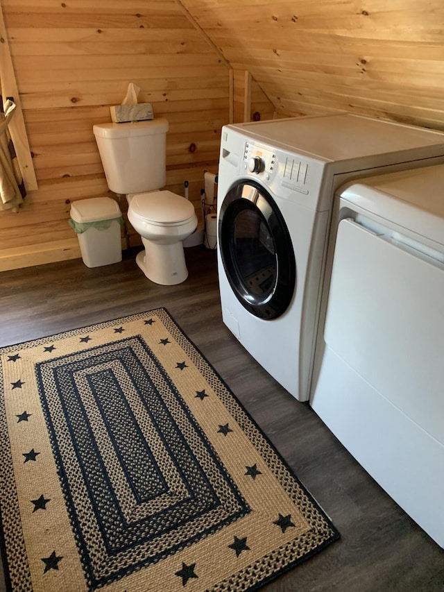 laundry room with dark hardwood / wood-style floors, wood walls, separate washer and dryer, and wood ceiling