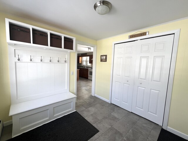 7 Edgewood Dr, Orono, ME 04473 - mudroom featuring baseboards