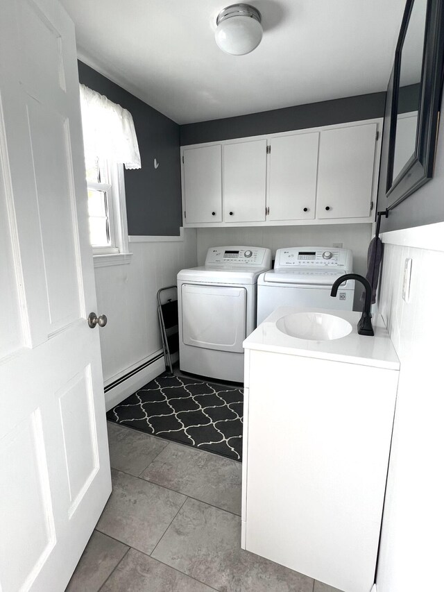 7 Edgewood Dr, Orono, ME 04473 - laundry area featuring a baseboard radiator, washing machine and dryer, cabinet space, and a wainscoted wall