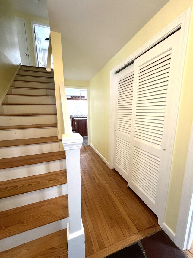 7 Edgewood Dr, Orono, ME 04473 - stairs with baseboards and wood finished floors