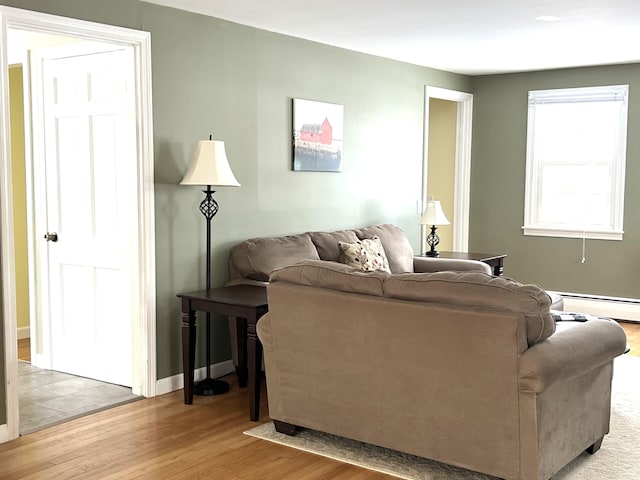 7 Edgewood Dr, Orono, ME 04473 - living room with light wood-style floors, a baseboard radiator, and baseboards