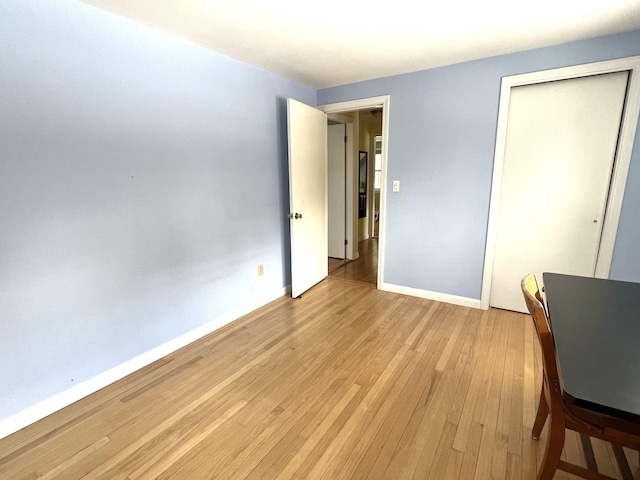 7 Edgewood Dr, Orono, ME 04473 - unfurnished bedroom featuring light wood-style flooring, baseboards, and a closet
