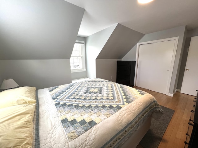7 Edgewood Dr, Orono, ME 04473 - bedroom with hardwood / wood-style flooring and vaulted ceiling