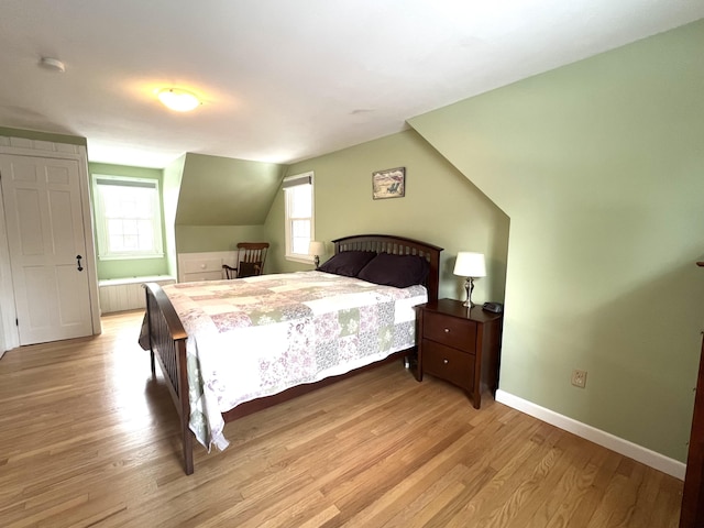 7 Edgewood Dr, Orono, ME 04473 - bedroom featuring light wood-type flooring, baseboards, and vaulted ceiling