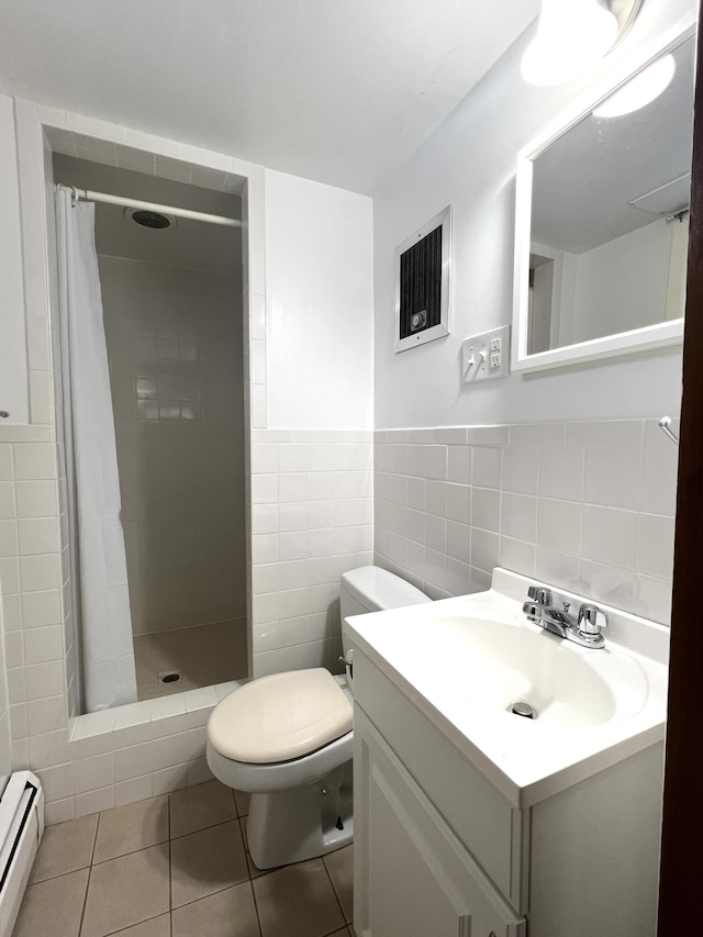 7 Edgewood Dr, Orono, ME 04473 - bathroom featuring a baseboard heating unit, tile walls, vanity, a shower stall, and toilet