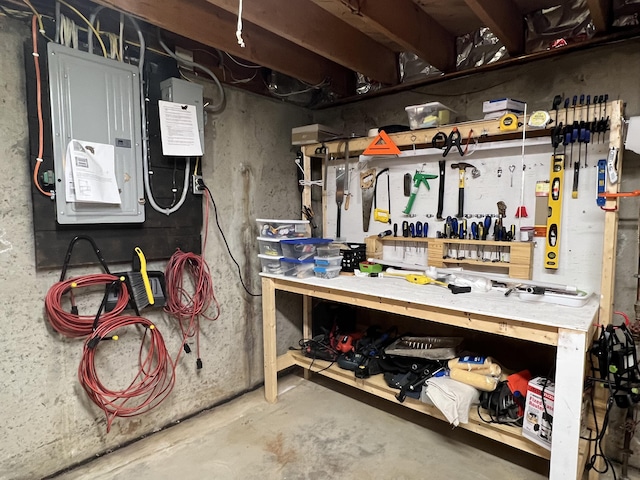 7 Edgewood Dr, Orono, ME 04473 - unfinished below grade area with electric panel and a workshop area