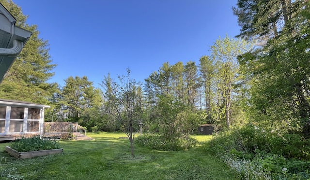 7 Edgewood Dr, Orono, ME 04473 - view of grassy yard with a deck and a sunroom
