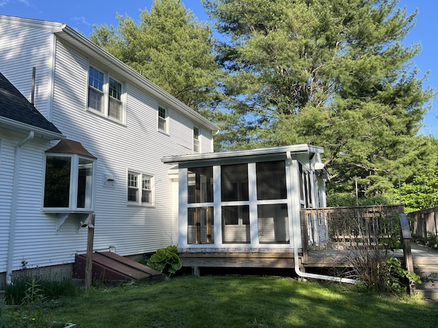 7 Edgewood Dr, Orono, ME 04473 - rear view of house with a sunroom and a deck