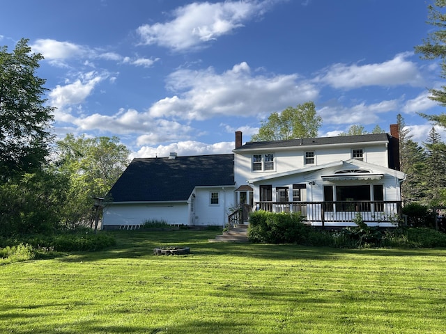 7 Edgewood Dr, Orono, ME 04473 - view of front facade featuring a chimney, a front lawn, and a deck
