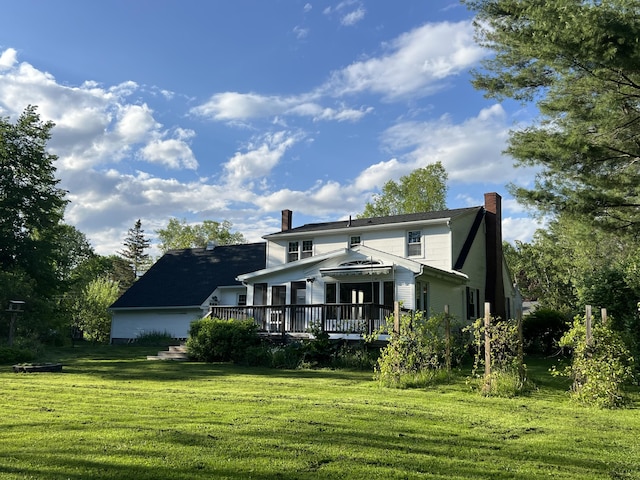 7 Edgewood Dr, Orono, ME 04473 - view of front facade featuring a chimney, a deck, and a front yard