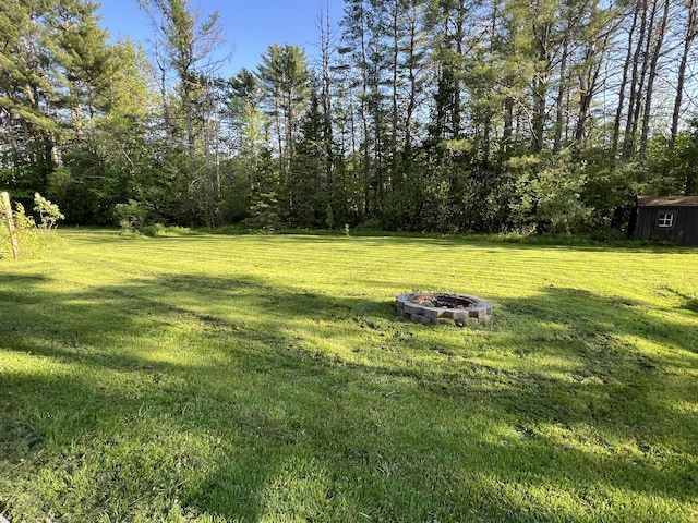 7 Edgewood Dr, Orono, ME 04473 - view of grassy yard with a fire pit