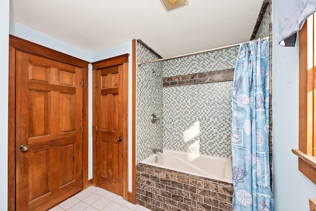 bathroom featuring shower / bath combo with shower curtain and tile patterned flooring