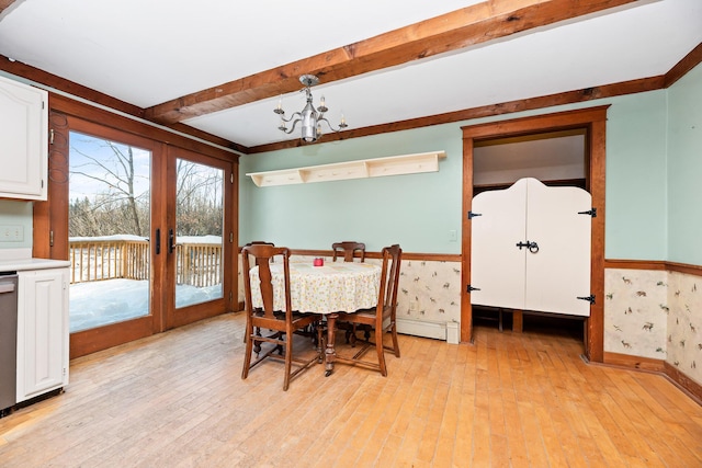 dining room with a chandelier, french doors, light wood-type flooring, and beam ceiling