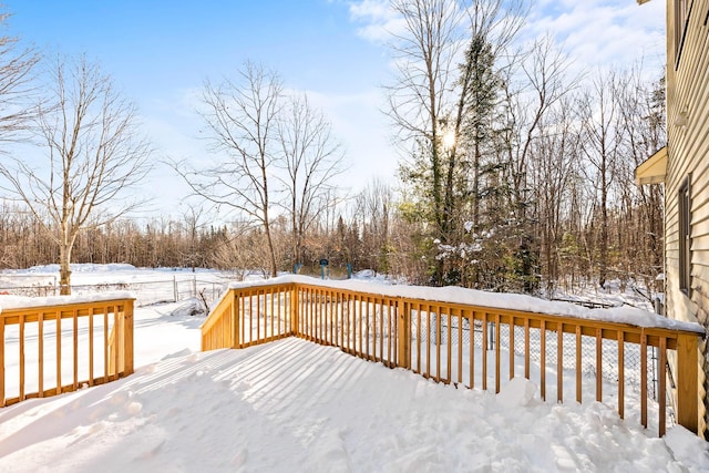 view of snow covered deck