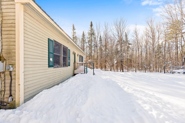 view of yard layered in snow