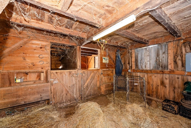 view of horse barn featuring electric panel