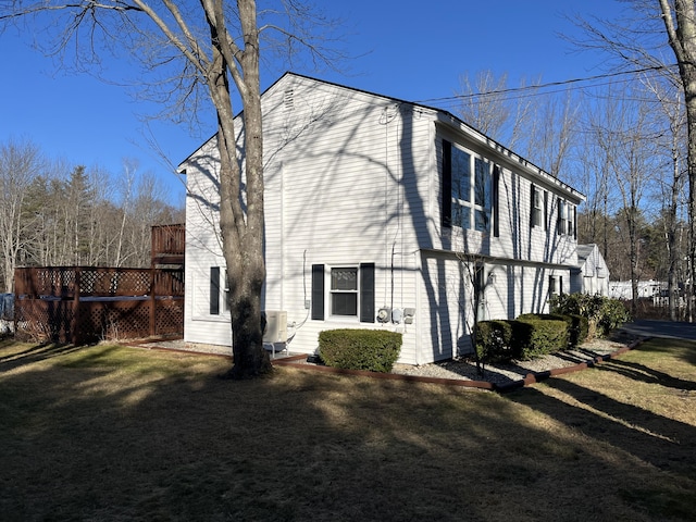 view of home's exterior with a yard