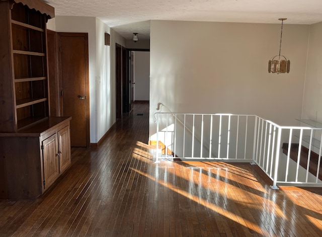 interior space with dark hardwood / wood-style flooring and a chandelier