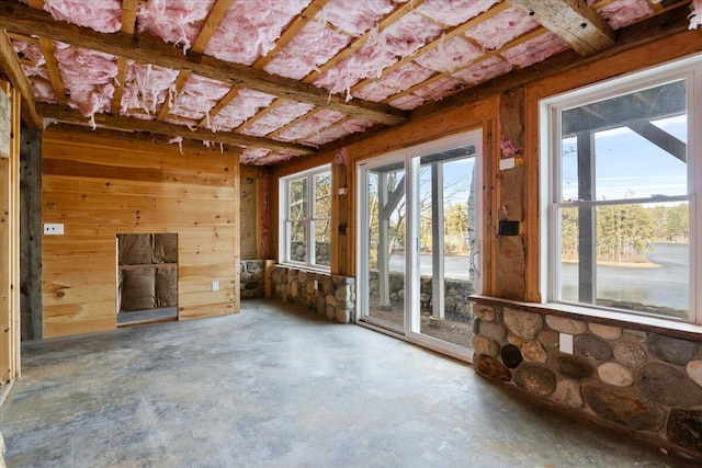 misc room with concrete flooring and a wealth of natural light