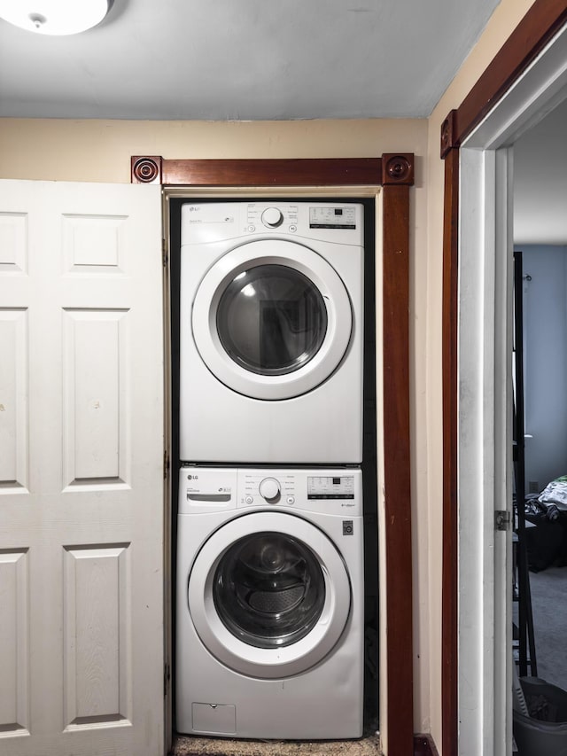 laundry room featuring stacked washer and dryer