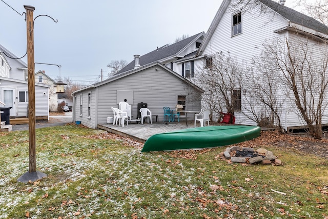 back of property with a patio area and a yard