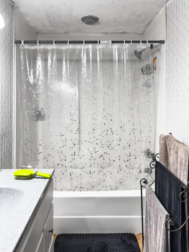 bathroom with vanity and shower / tub combo with curtain