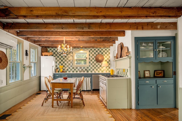 681 Sedgwick Ridge Rd, Sedgwick, ME 04676 - dining area featuring a chandelier, beam ceiling, healthy amount of natural light, and light wood-type flooring